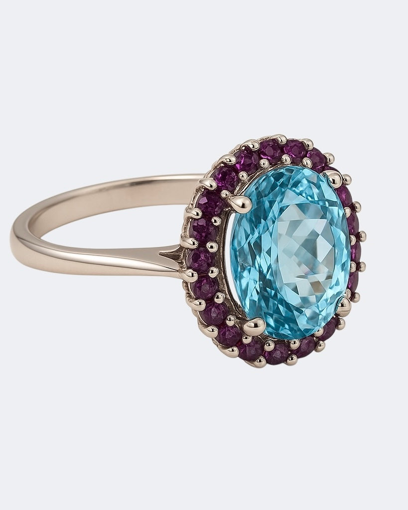 18kt White Gold Ring with Sky Blue Topaz and Claret Rhodolite Accents