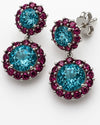 18Kt White Gold Earrings with Vivid Blue Topaz with Rhodolite Accents.